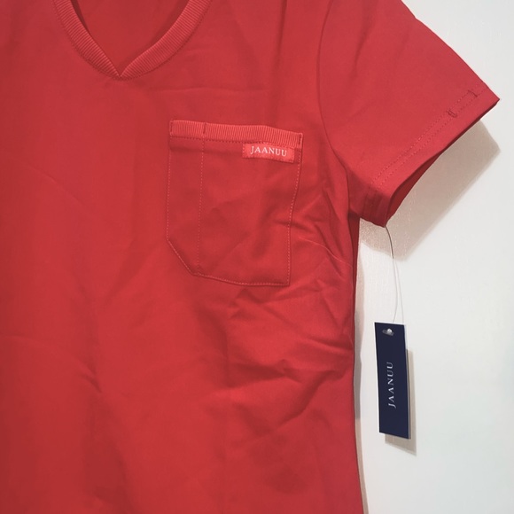 Never worn Jaanuu scrub top. - Picture 2 of 2